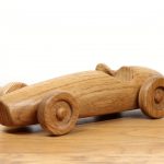 Photograph of a hand made oak car based on the Ferrari F2 500 1953 race car