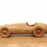 Photograph of a hand made oak car based on the Ferrari F2 500 1953 race car